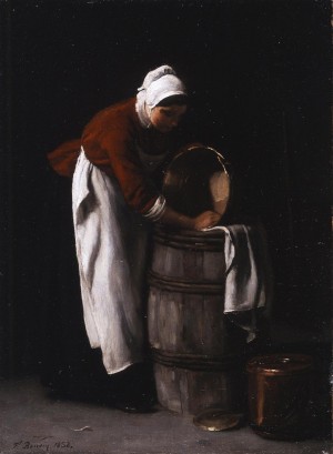 A woman cleaning a barrel